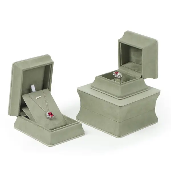 Custom Premium Leather Ring Jewelry Boxes with Cinched Waist Design Custom leather ring jewelry boxes with waist-cinch closure, showing interior compartments and custom branding options