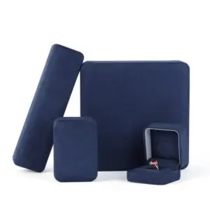Navy blue velvet earring boxes with custom foam inserts and gold-embossed logo – premium jewelry packaging