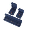 Navy blue velvet earring boxes with custom foam inserts and gold-embossed logo – premium jewelry packaging