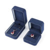 Navy blue velvet earring boxes with custom foam inserts and gold-embossed logo – premium jewelry packaging